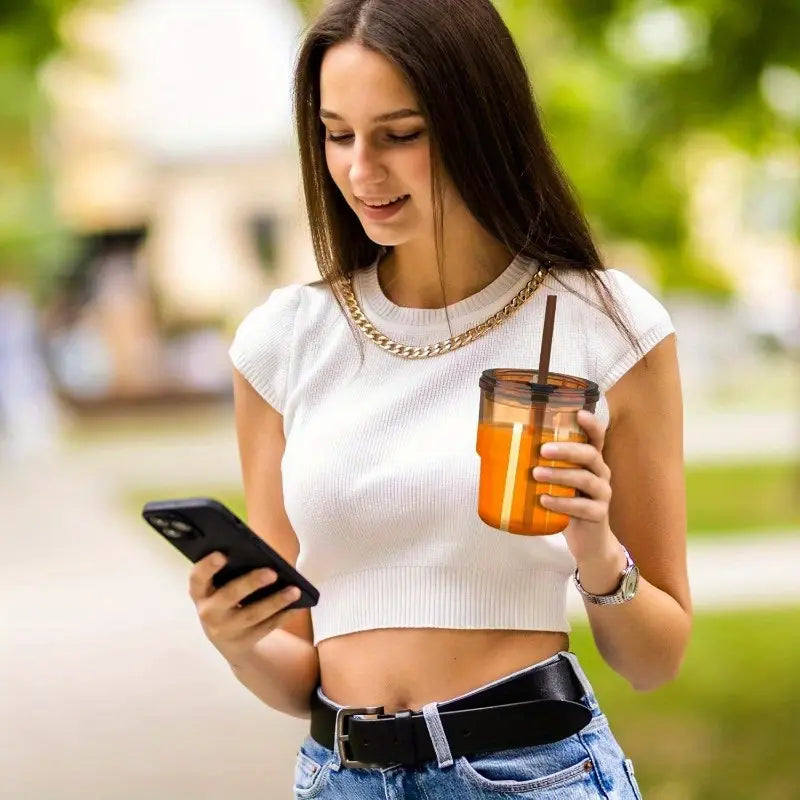 Over glass water bottle with straw
